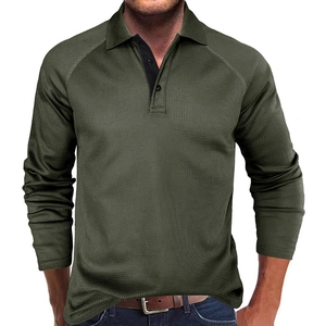 Detail of olive green waffle knit texture on long sleeve polo shirt with 3-button placket