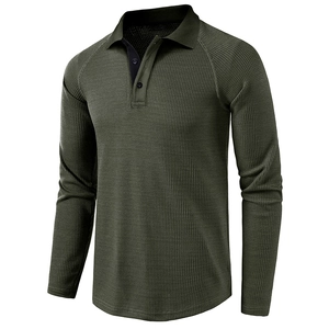 Detail of olive green waffle knit polo shirt with raglan sleeves and three-button placket