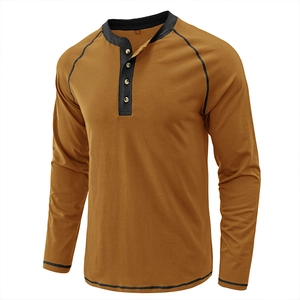 Detail view of the contrast color buttons and collar on the vintage long sleeve Henley shirt