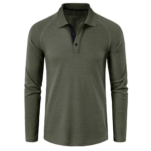 Detail of army green waffle knit texture on men's long sleeve polo shirt with buttons