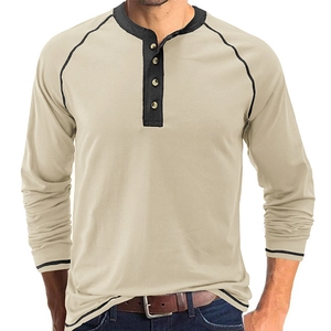 Close-up of men's vintage beige Henley shirt with black contrast raglan sleeves