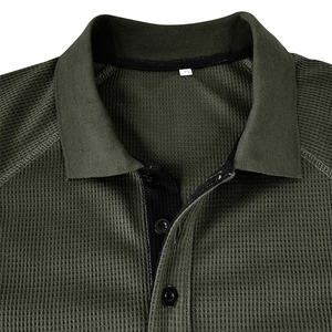 Detail of olive green waffle knit Polo shirt showing collar texture and three-button placket