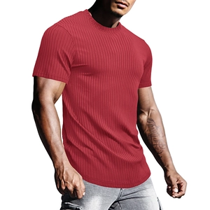 Close-up of red compression sports t-shirt with vertical texture and curved hemline
