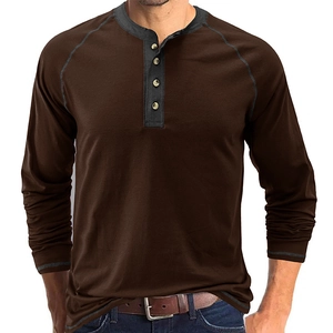 Close-up of brown heavy cotton long sleeve Henley shirt with contrast collar detail