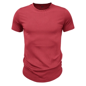 Detail view of red ribbed knit texture and inner size S label on men's compression t-shirt