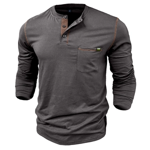 Detail of dark grey Henley shirt featuring contrast brown stitching and chest pocket