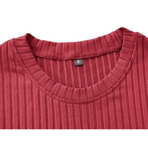 Macro shot of dark red ribbed neckline with durable stitching on men's athletic shirt
