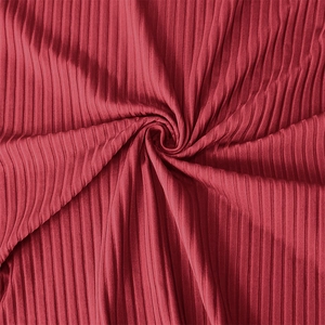 Macro shot of red ribbed elastic knit fabric with high-quality vertical texture