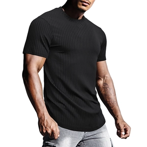 Detail of black vertical ribbed fabric and curved hem on men's athletic short sleeve t-shirt