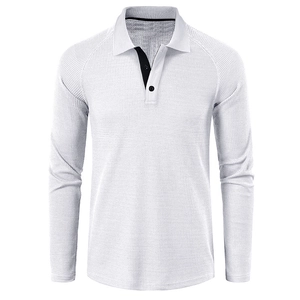 Detailed close-up of white waffle texture fabric and black contrast placket on polo shirt