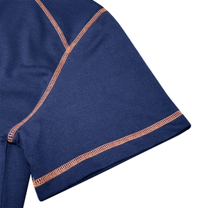 Close-up of navy mesh fabric polo shirt sleeve with orange contrast stitching detail