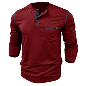 Detailed close-up of burgundy long sleeve Henley shirt with contrast stitching and chest pocket