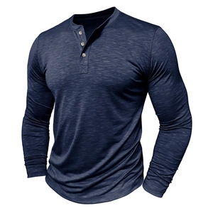 Detailed view of dark blue slub cotton texture and three-button neckline of the Henley shirt