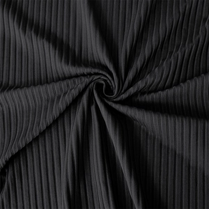 Detailed view of black ribbed knit fabric showing vertical texture and material softness