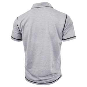 Detail view of the back of a grey polo shirt with black contrast stitching and melange fabric