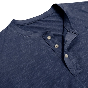 Detailed close-up of navy Henley shirt featuring three wood buttons and slub fabric texture