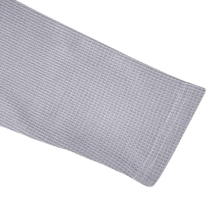 Detailed close-up of grey waffle knit polo shirt cuffs with neat double-stitched hem