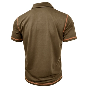 Detail view of brown polo shirt back featuring orange contrast stitching and breathable mesh