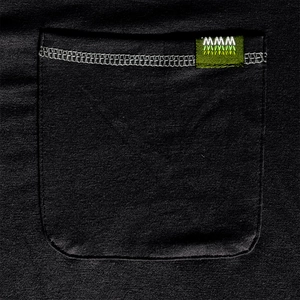 Close-up of black knitted shirt pocket with white stitching and brand woven label