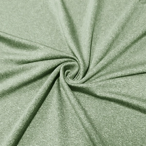 Dettaglio del tessuto verde salvia traspirante con trama in maglia a nido d'ape fine