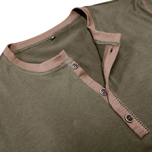 Detail view of the olive green Henley shirt with brown collar trim and black buttons