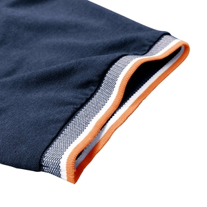 Detail of ribbed cuff on dark blue Polo shirt with orange and white striped accents