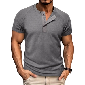 Macro detail of men's grey waffle knit Henley shirt with classic three-button placket