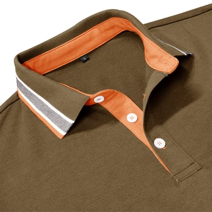 Detail view of brown polo shirt collar with orange contrast and pique fabric texture