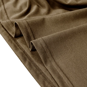 Macro view of dark brown pique fabric texture with durable double-needle hem stitching