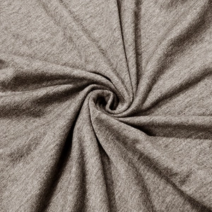 Macro shot of brown heather knit fabric showing soft texture and natural drape of the shirt