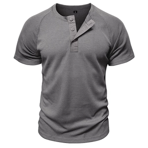 Close-up of men's grey waffle knit henley t-shirt showing texture and three-button placket