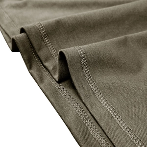Close-up of olive green cotton knit fabric with professional double needle stitching detail