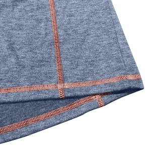 Detail of grey fabric showing copper four-needle six-thread flatlock stitching process
