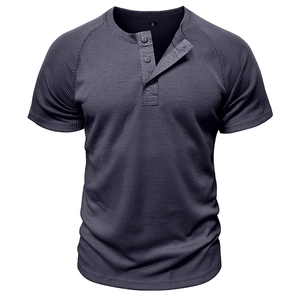 Detail view of Men's dark grey waffle knit Henley T-shirt with three-button neckline