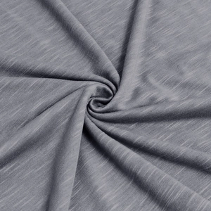 Macro detail of heather gray slub cotton fabric showing soft texture and knit pattern