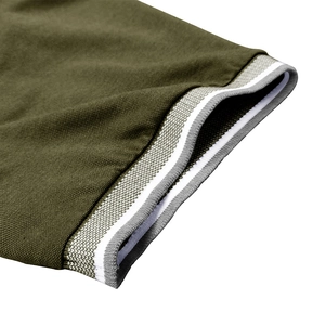 Detail of army green piqué polo shirt sleeve with grey and white striped ribbed cuff