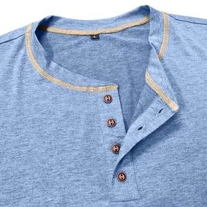 Close-up of light blue Henley shirt neckline with contrasting khaki trim and buttons