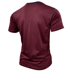 Detail view of burgundy short sleeve T-shirt with navy contrast stitching on back shoulder
