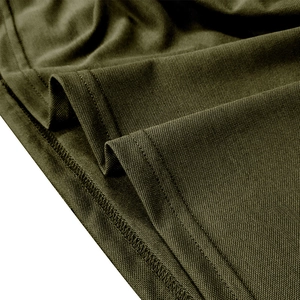 Macro shot of olive green pique knit fabric with durable double-stitched hem on Polo shirt