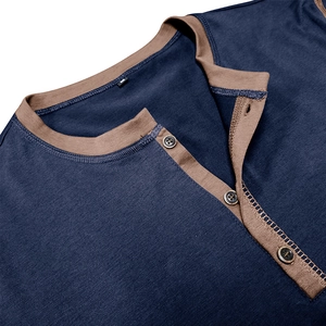 Detail of three-button Henley collar with navy and brown contrast jersey fabric texture