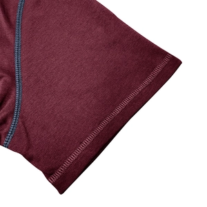 Close-up of wine red Henley shirt sleeve with grey double-needle stitching detail