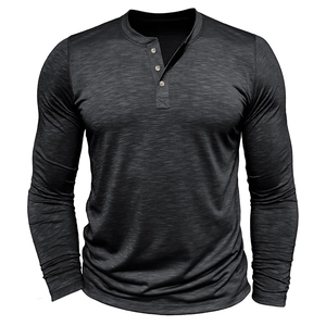 Detailed macro view of charcoal grey slub cotton fabric texture on men's Henley shirt