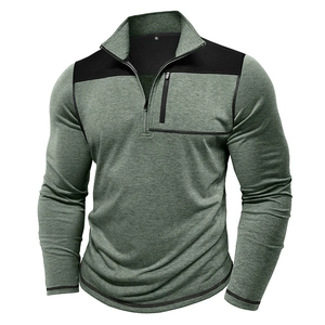 Detail of green heathered tactical pullover showing black shoulder contrast and chest pocket