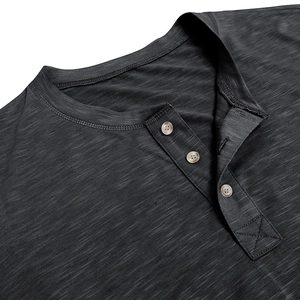 Detailed macro view of dark heather grey slub cotton Henley neck with three buttons