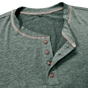 Detail of dark green Henley shirt neckline with four wood-textured buttons and knit texture