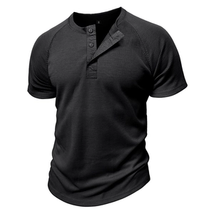 Close-up of black waffle knit texture and three-button neckline on men's Henley T-shirt
