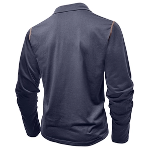 Detail of navy long-sleeve polo shirt featuring contrast brown stitching on shoulders
