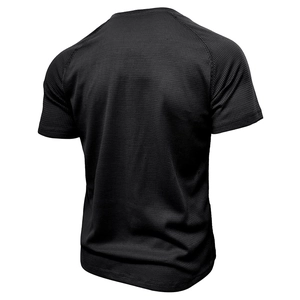 Detail of black waffle knit fabric and raglan sleeve construction on men's Henley shirt