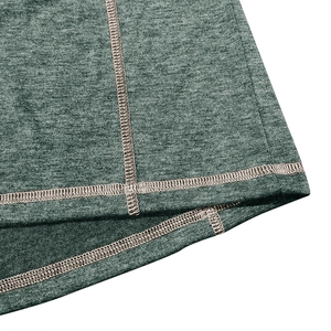 Detailed close-up of double-needle stitching and heather green knit fabric texture