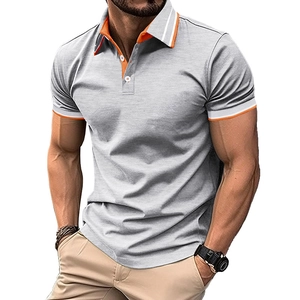 Detail of grey polo shirt with orange and white contrast stripes on collar and cuffs